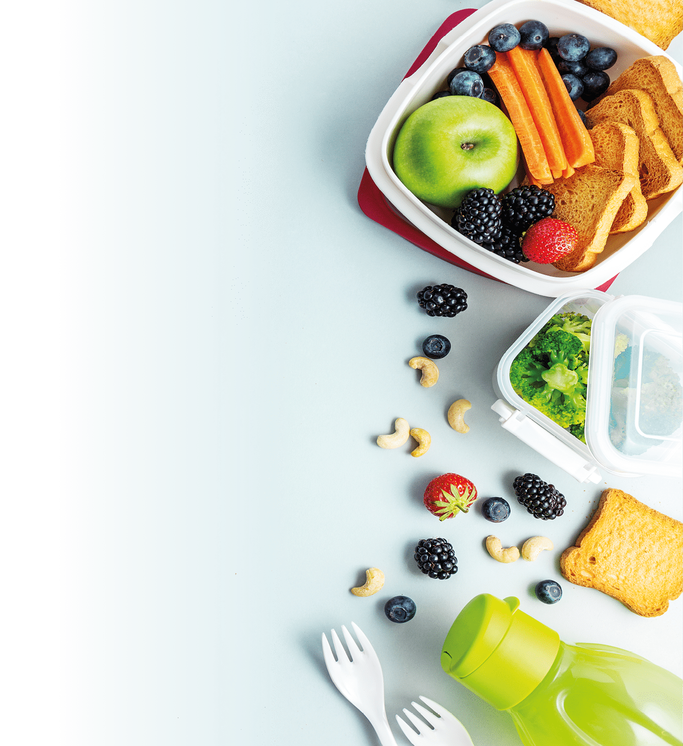 Healthy lunch to go  Fruits and vegetables packed in lunch box  Healthy eating concept  View from above with copy space  